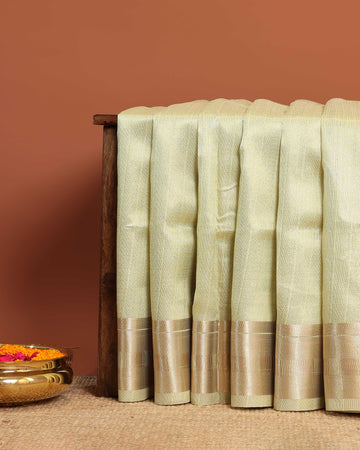 Elegant Semi Tissue Saree with Subtle Zari Border and Lustrous Finish – Green
