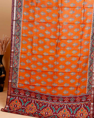 Rich Orange Patola Silk Saree with Intricate Floral Motifs and Black Contrast Pallu