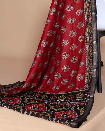Rich Maroon Patola Silk Saree with Intricate Floral Motifs and Black Contrast Pallu