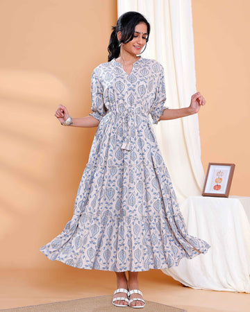 Elegant Beige Long Dress with Blue Leaf Motifs and Flared Hem