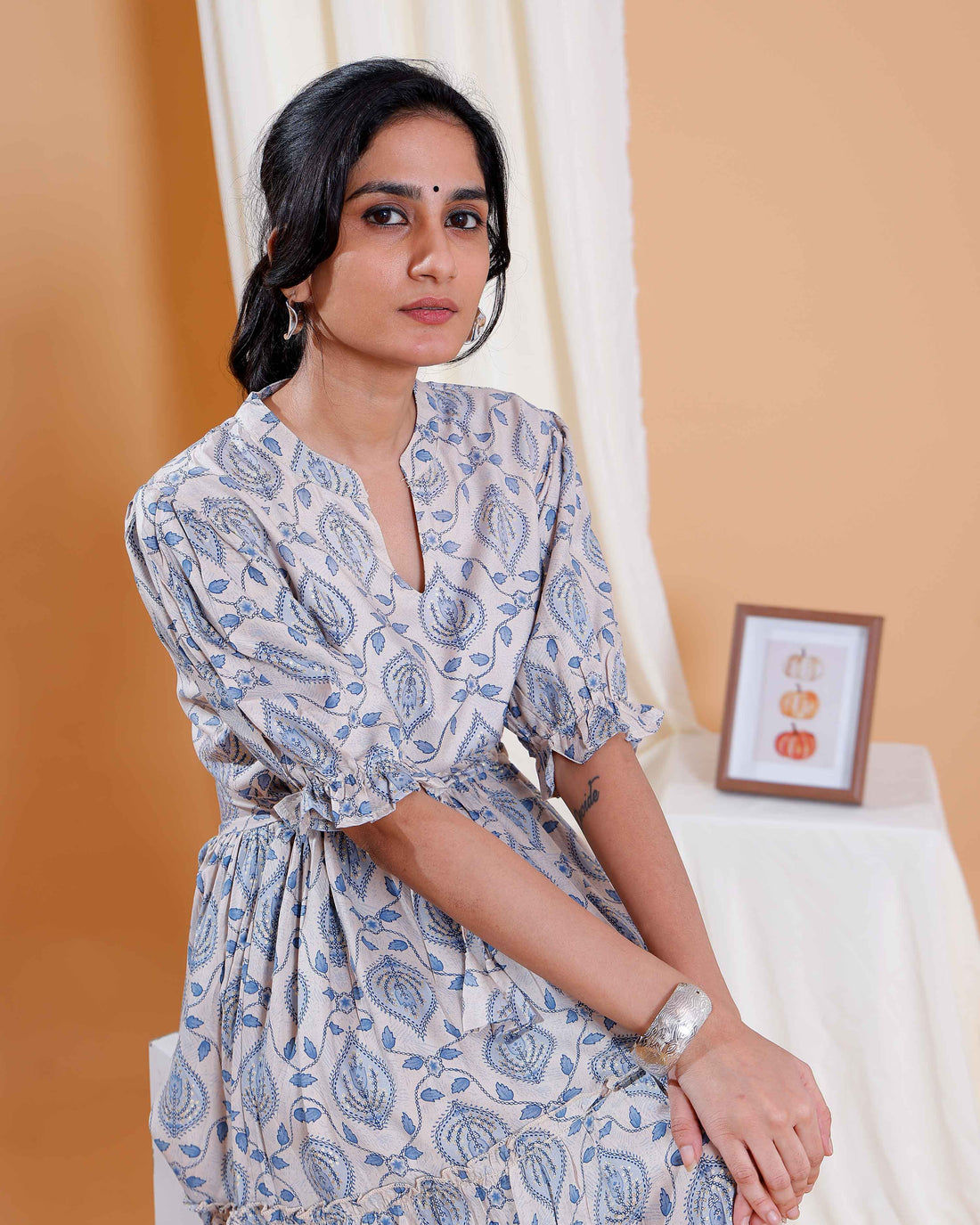 Elegant Beige Long Dress with Blue Leaf Motifs and Flared Hem