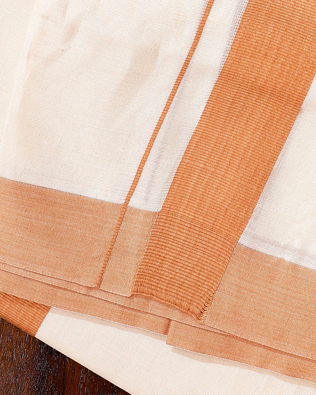 Traditional Handwoven Cotton Dhoti with Orange Border and Elegant Finish - Off White