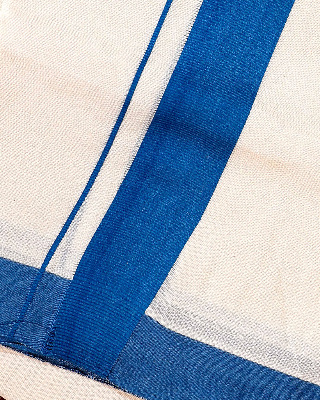 Traditional Handwoven Cotton Dhoti with Blue Border and Elegant Finish - Off White