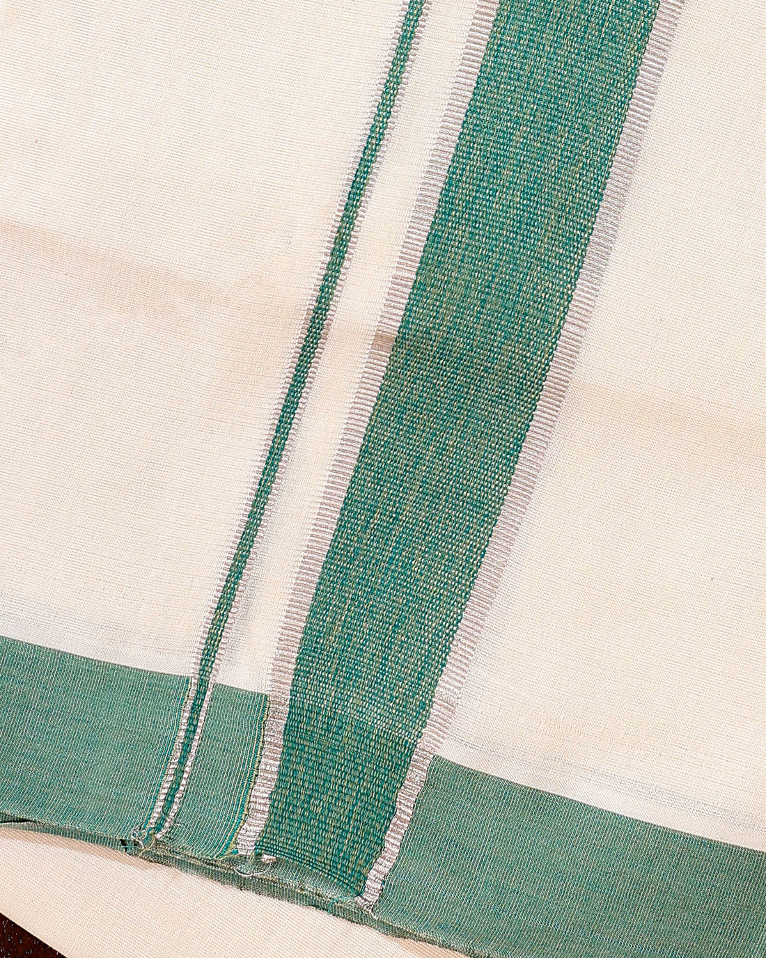 Traditional Handwoven Cotton Dhoti with Green Border and Elegant Finish - Off White