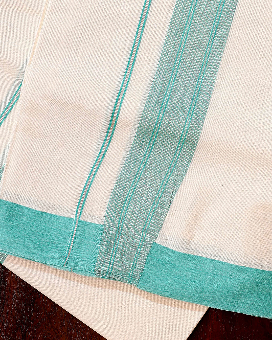 Traditional Handwoven Cotton Dhoti with Sky Blue Border and Elegant Finish - Off White