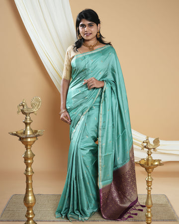 Elegant Handwoven Banarasi Silk Saree Accented with Subtle Zari Buttas and a Classic Zari Border - Green