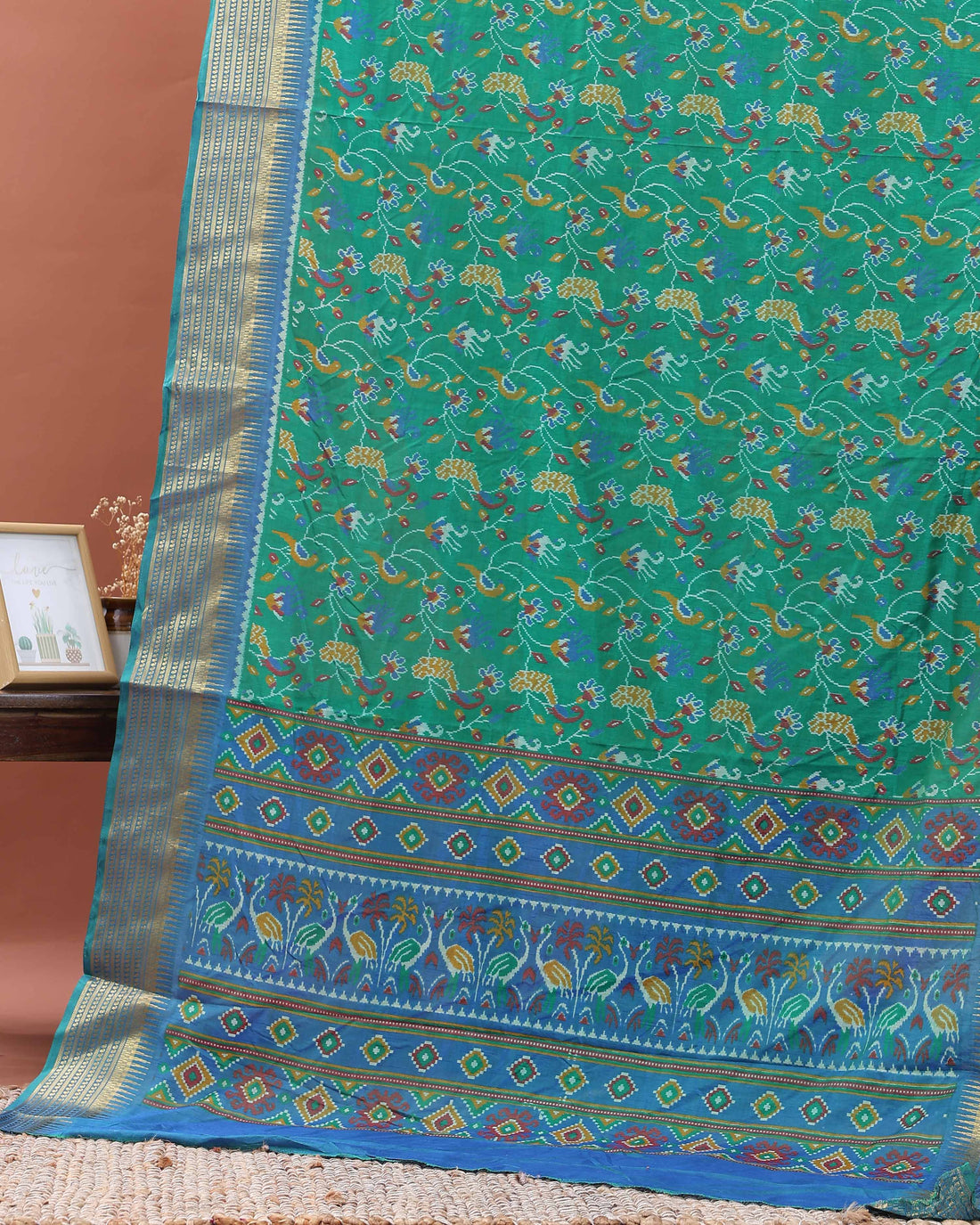 Elegant Patola Saree with Classic Peacock and Geometric Border - Green