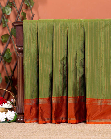 Elegant Soft Silk Saree with a Classic Zari Striped Pattern and Rich Contrast Border - Green