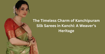 Woman wearing a traditional green and red Kanchipuram silk saree with zari border.