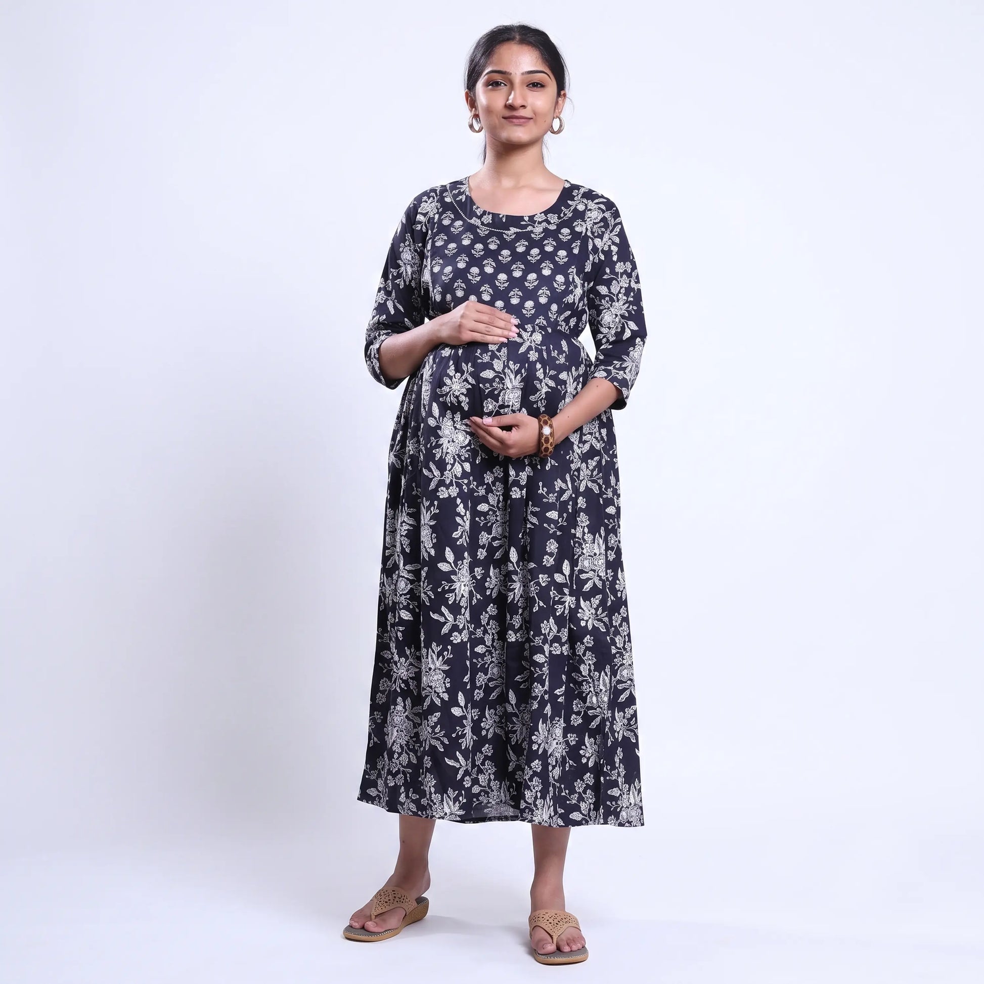 Black printed maternity wear with empire waist and three quarter sleeves front view 