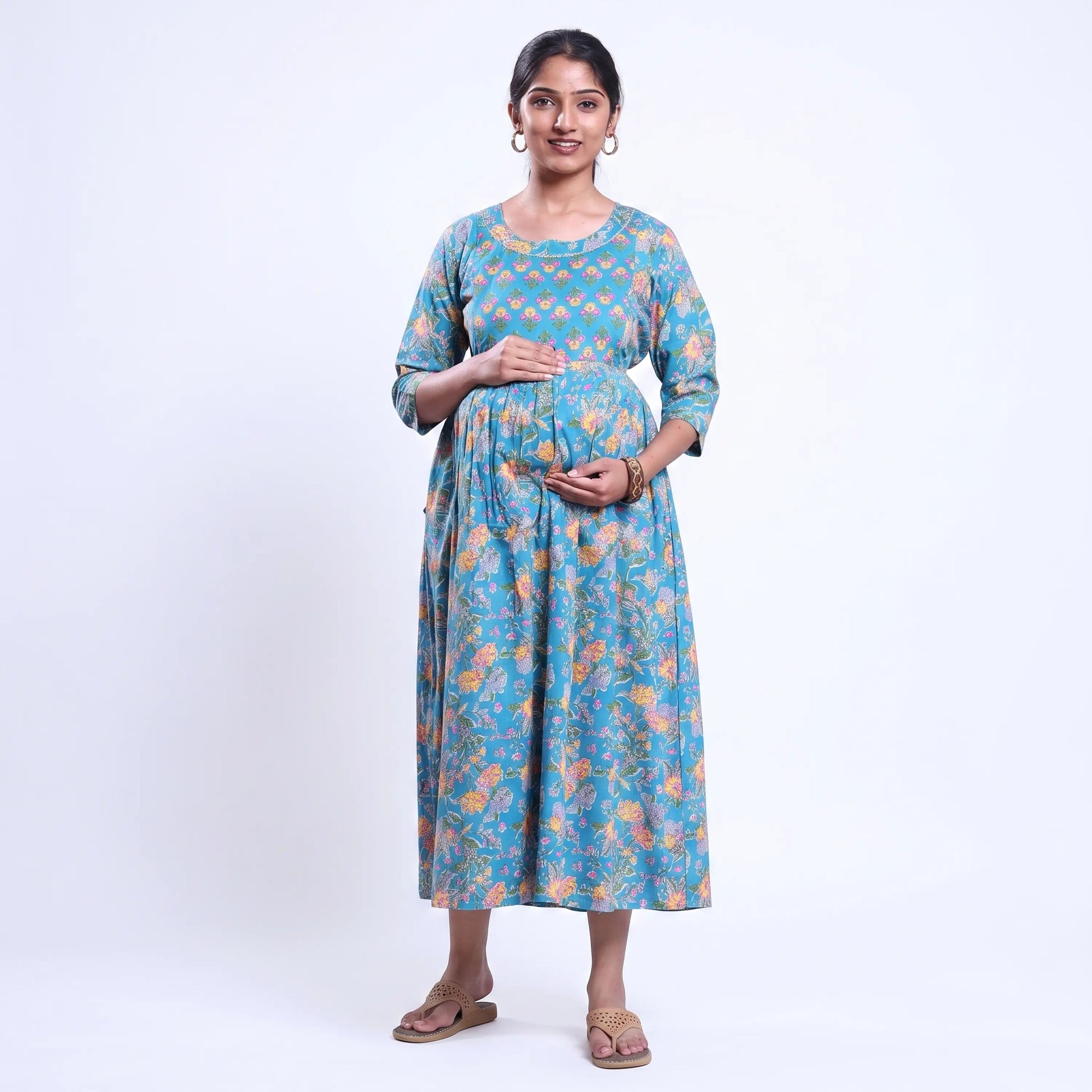 Blue printed maternity wear with empire waist and three quarter sleeves front view 