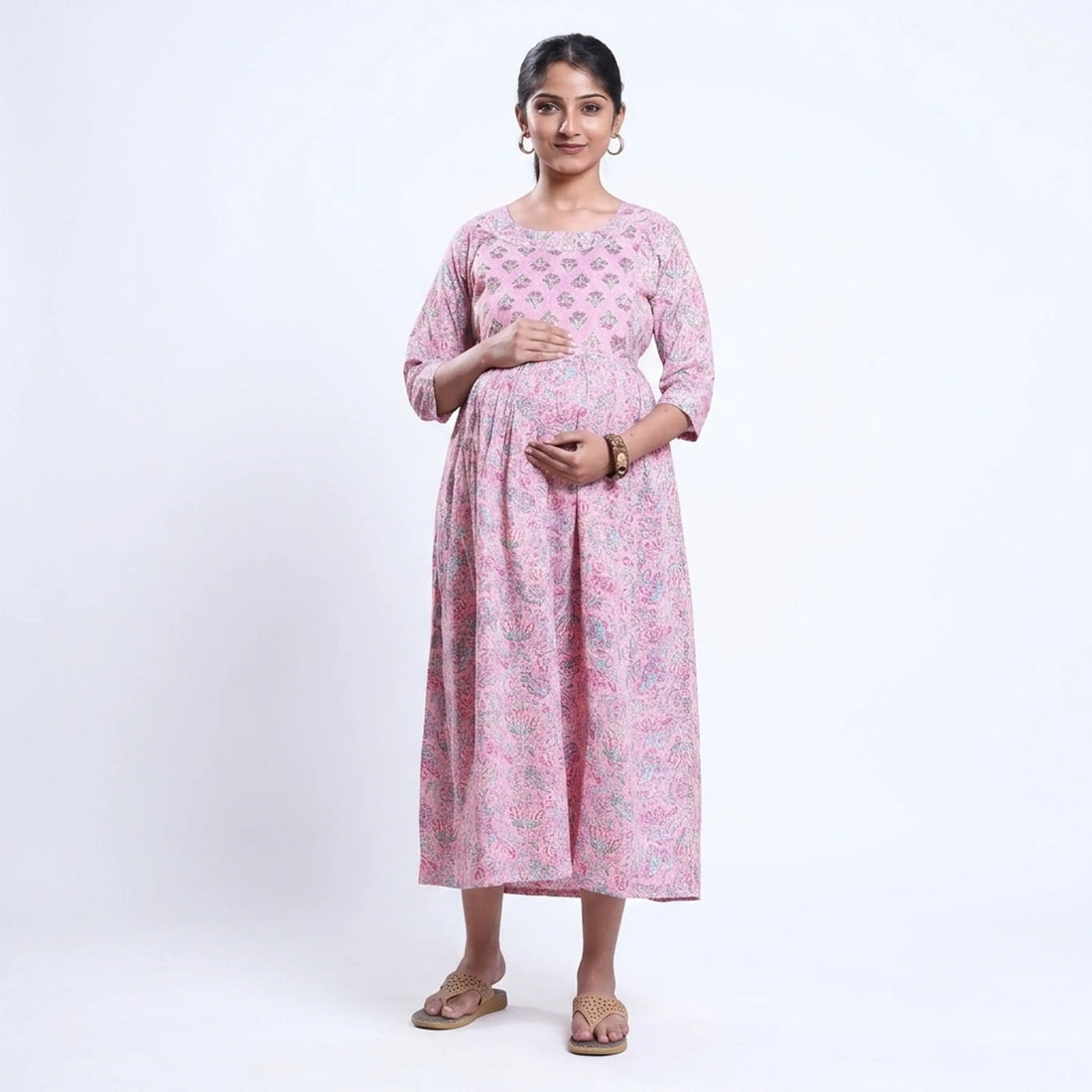 Pink printed maternity wear with empire waist and three quarter sleeves front view 