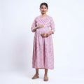 Pink printed maternity wear with empire waist and three quarter sleeves front view 