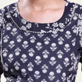 Black printed maternity wear with empire waist and three quarter sleeves front view 