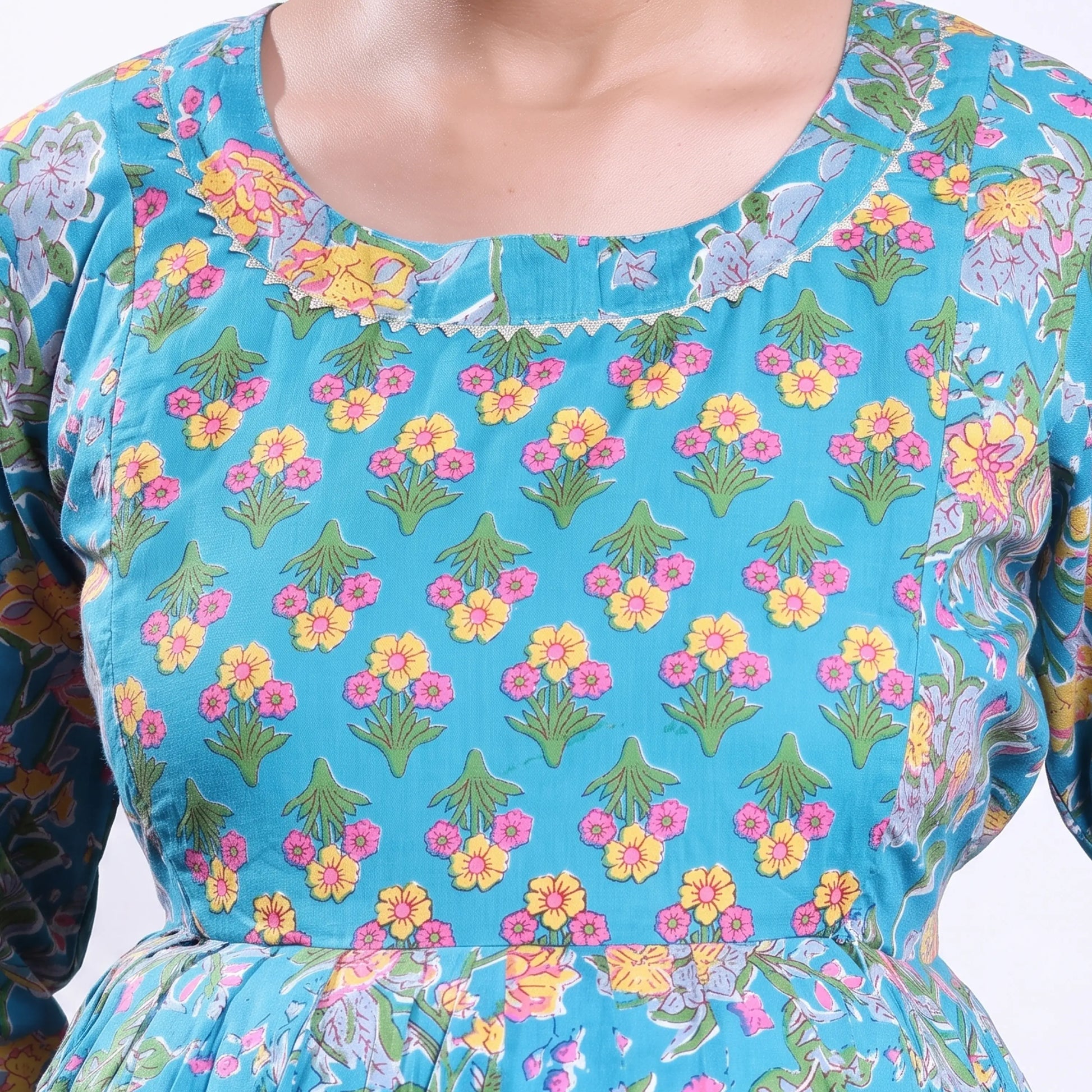 Blue printed maternity wear with empire waist and three quarter sleeves front view 