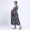 Black printed maternity wear with empire waist and three quarter sleeves front view 