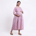 Pink printed maternity wear with empire waist and three quarter sleeves front view 