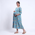 Blue printed maternity wear with empire waist and three quarter sleeves front view 