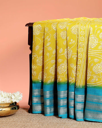 Graceful Dola Silk Saree with Intricate Floral Bandhani Print and Rich Zari Striped Border - Yellow