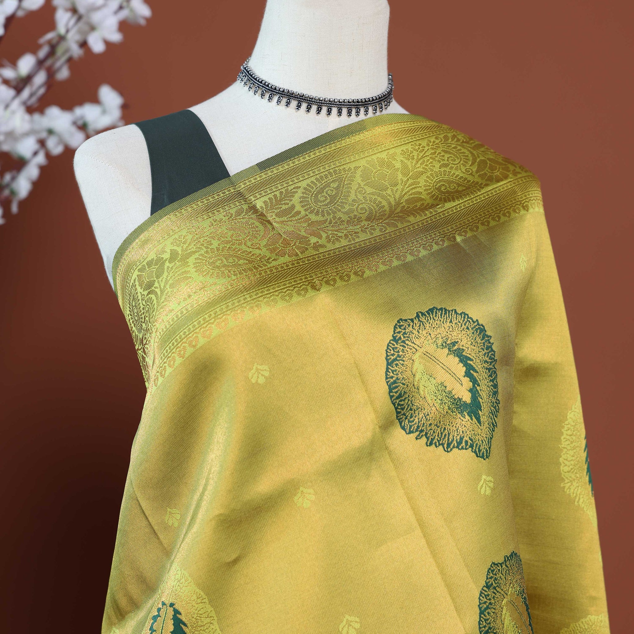 Traditional Litchi Silk Saree with Intricate Zari Border and Bold Floral Woven Motifs - Green