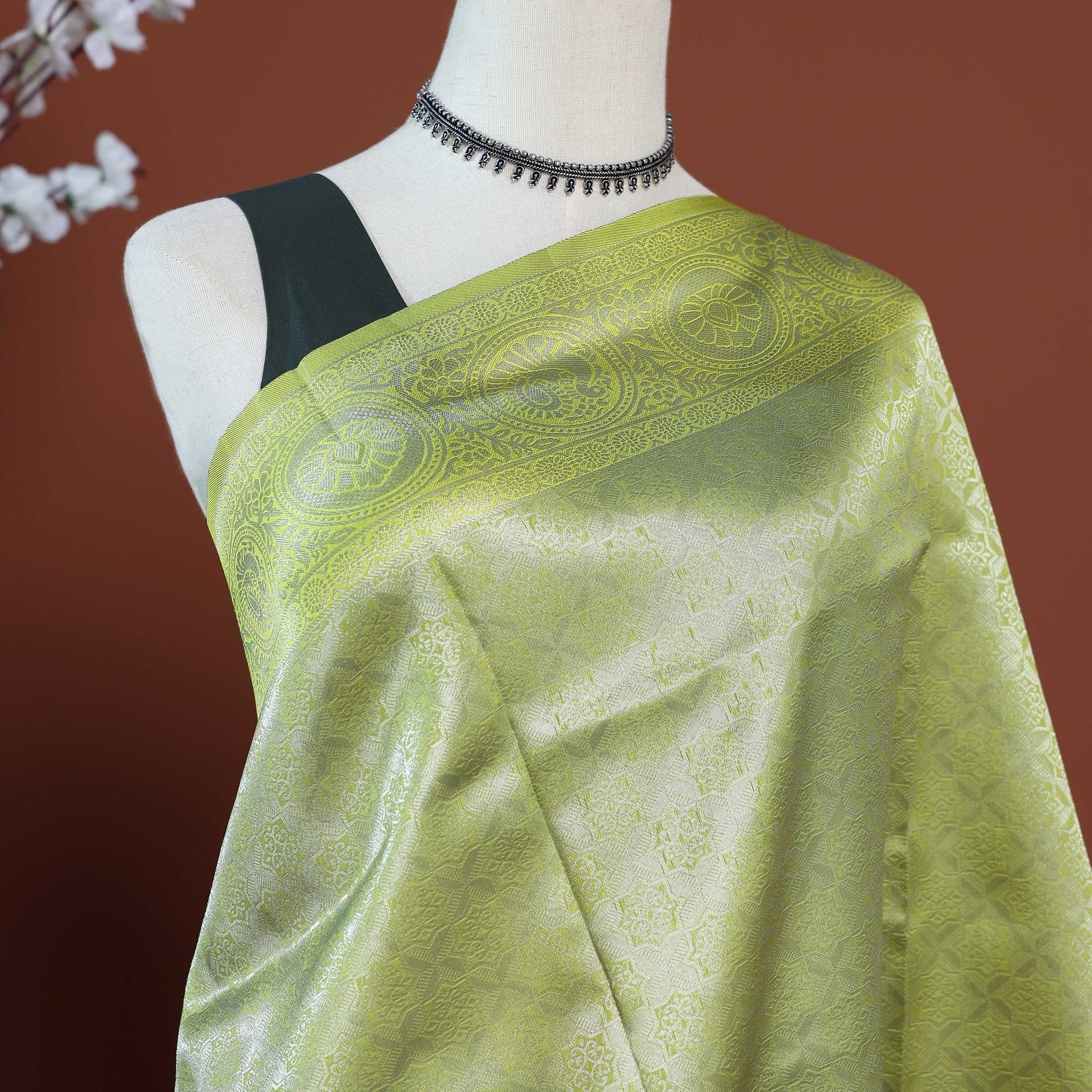 Litchi Silk Saree with Grand Circular Zari Border and Subtle All-Over Jacquard Weaving - Green