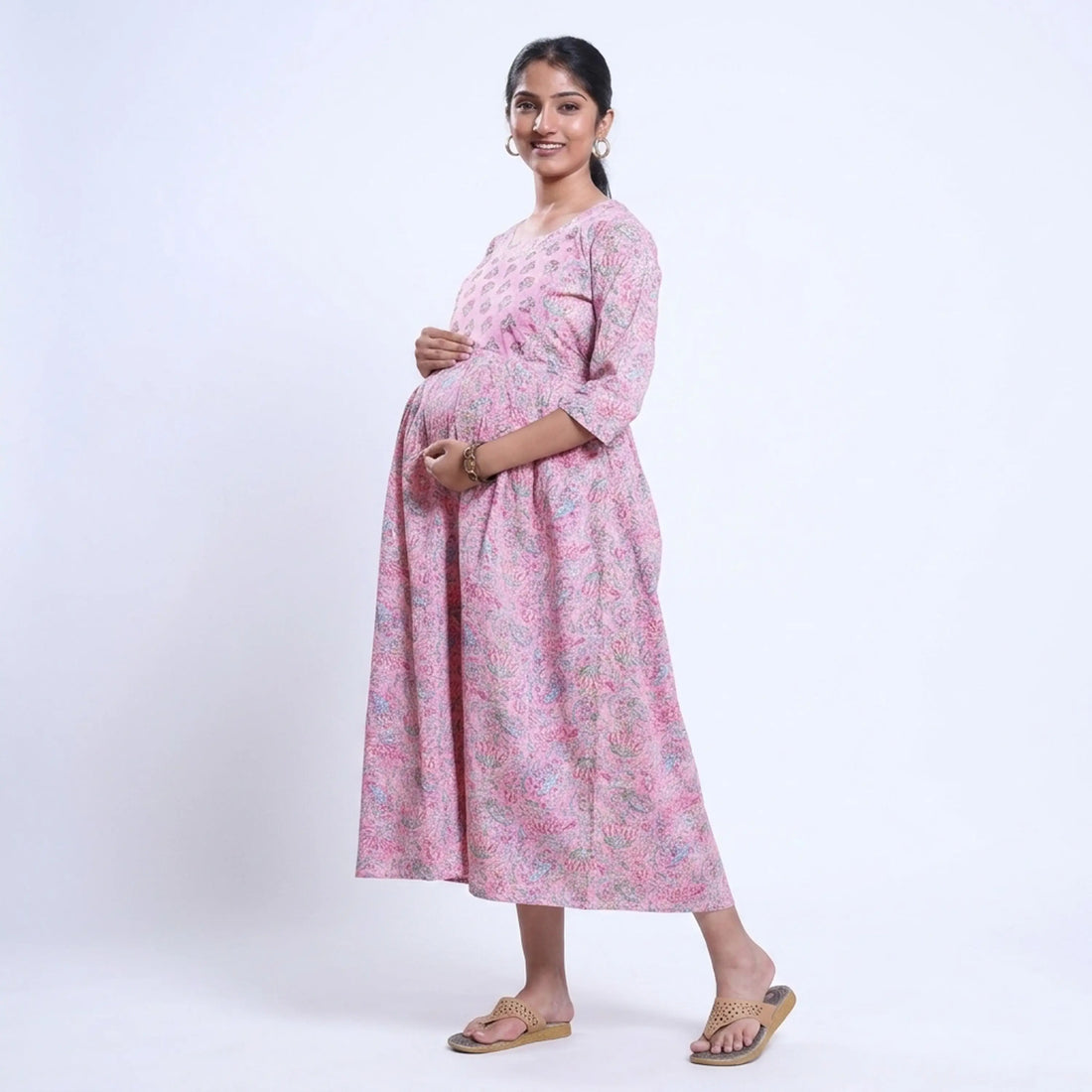 Pink printed maternity wear with empire waist and three quarter sleeves front view 