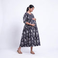 Black printed maternity wear with empire waist and three quarter sleeves front view 