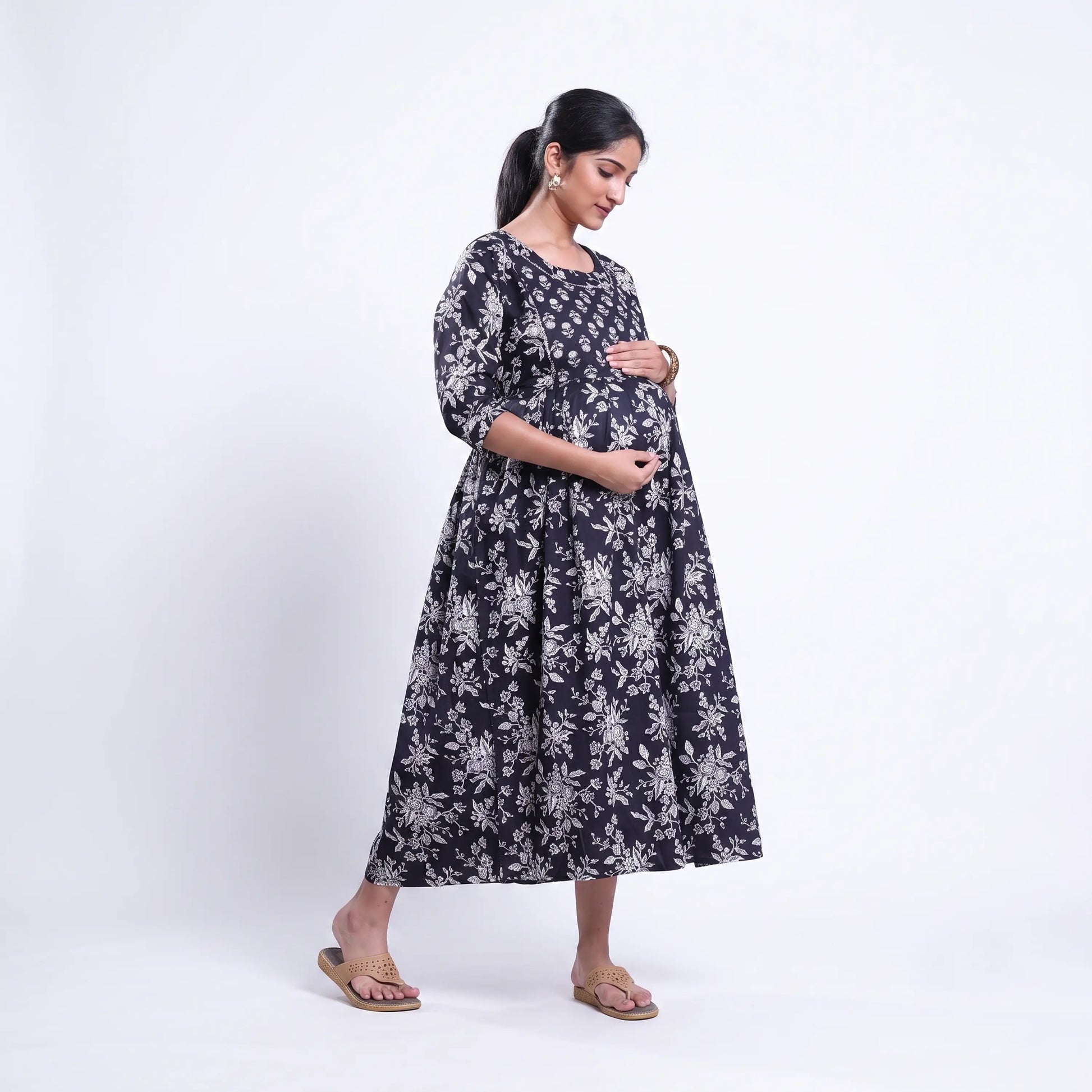Black printed maternity wear with empire waist and three quarter sleeves front view 