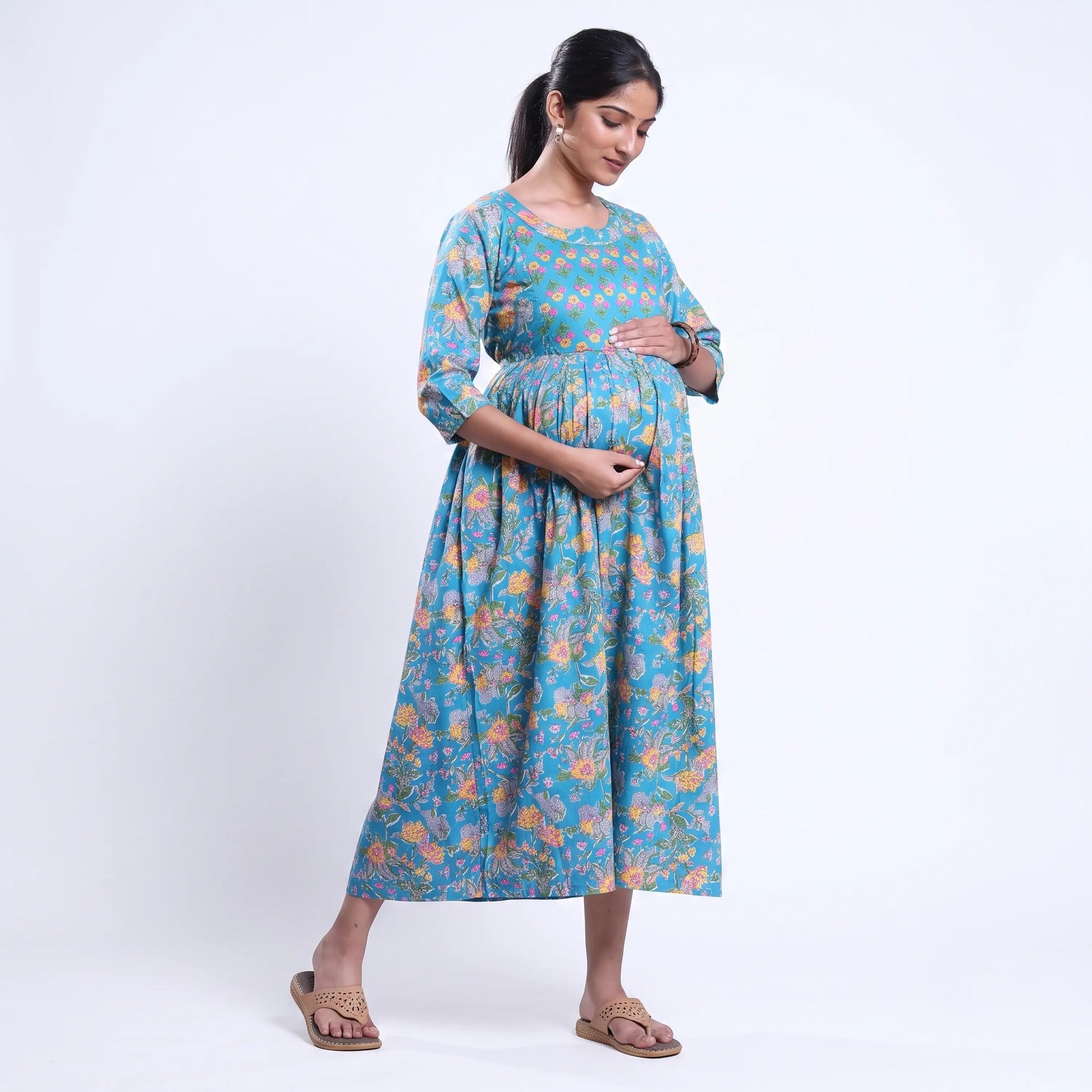 Blue printed maternity wear with empire waist and three quarter sleeves front view 