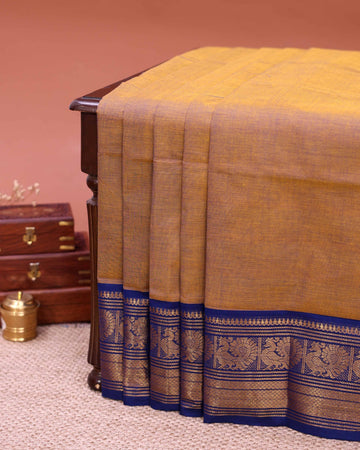 Traditional Venkatagiri Cotton Saree with Textured Body and Intricate Zari Woven Peacock Motif Border  - Brown