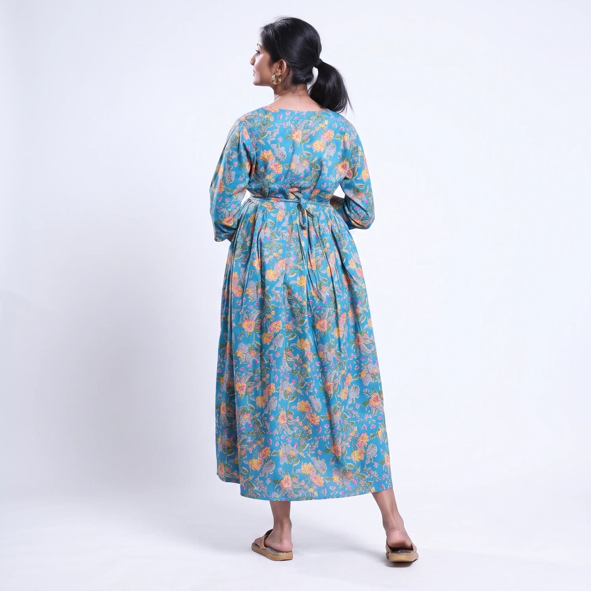 Blue printed maternity wear with empire waist and three quarter sleeves front view 