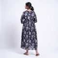 Black printed maternity wear with empire waist and three quarter sleeves front view 