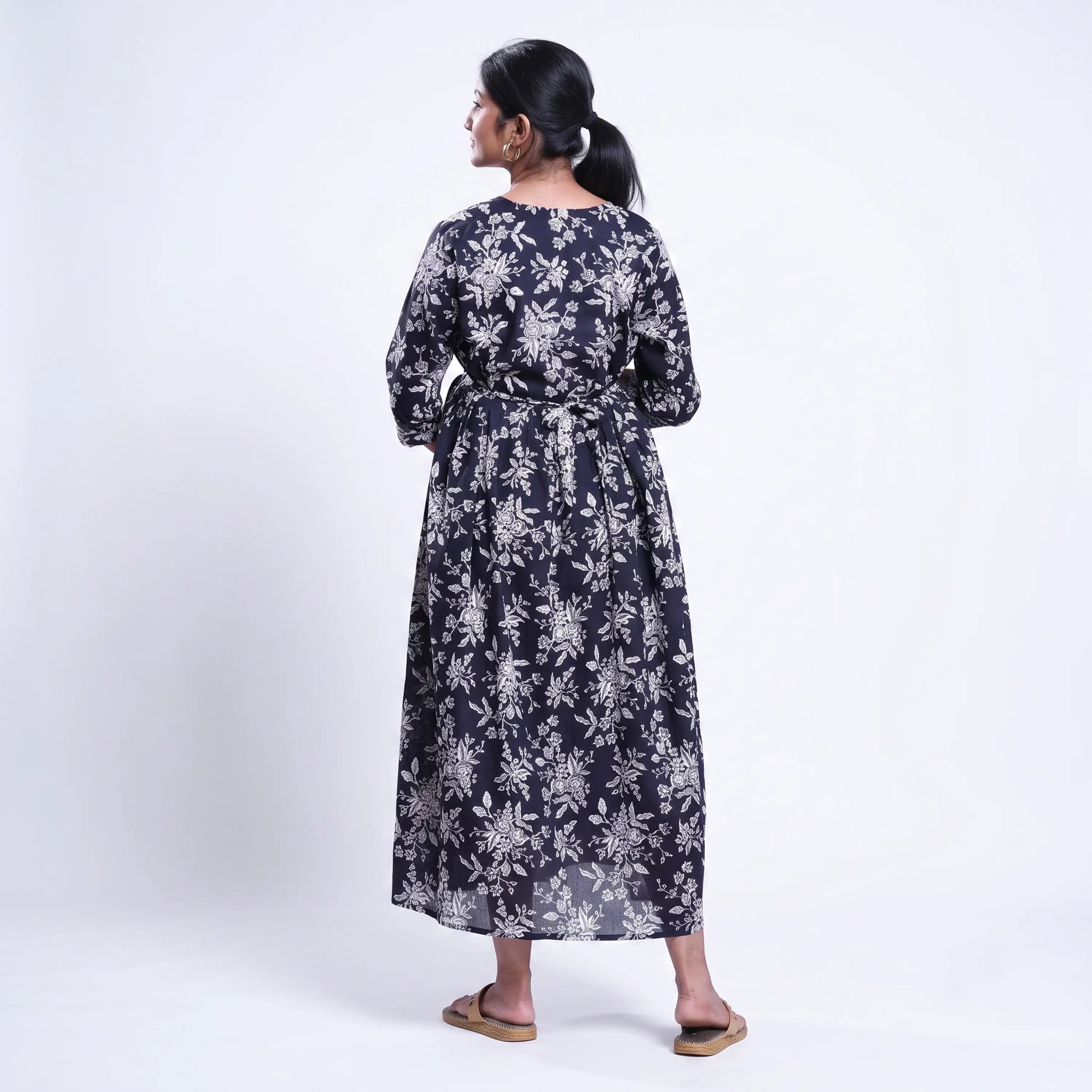 Black printed maternity wear with empire waist and three quarter sleeves front view 