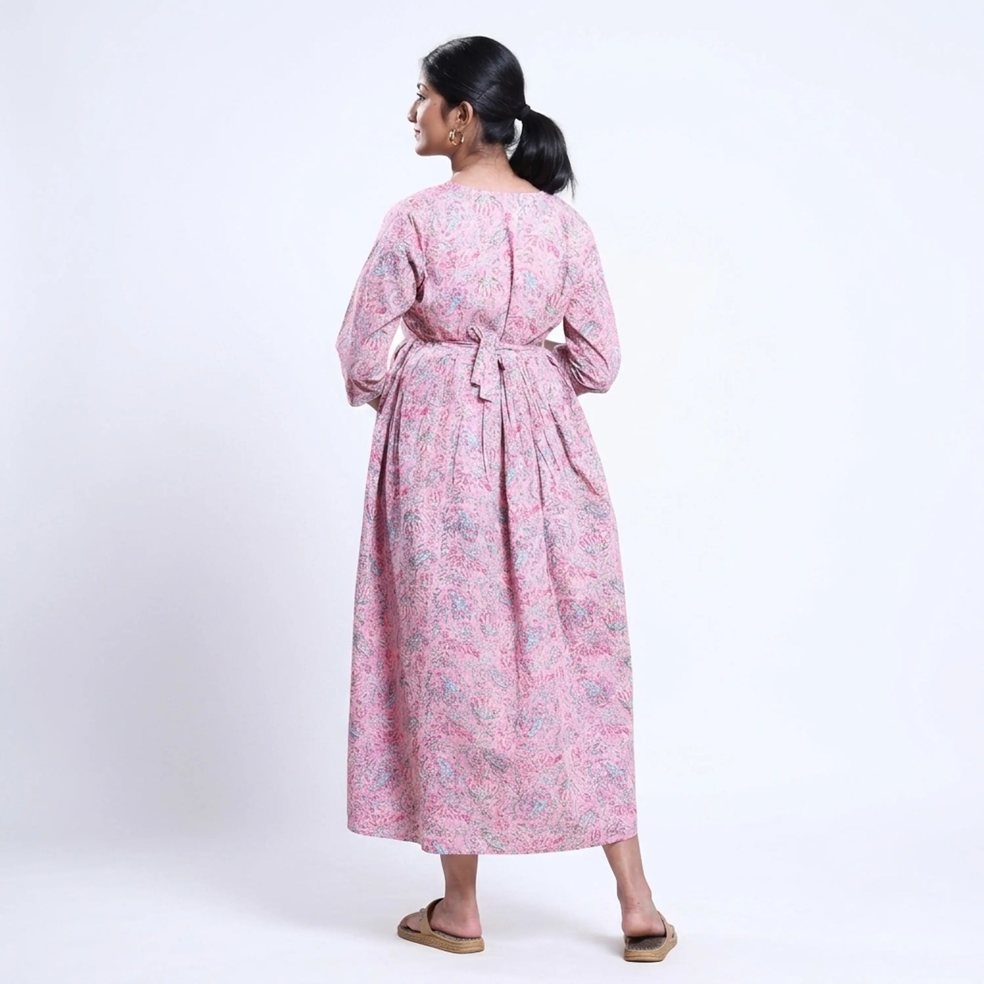 Pink printed maternity wear with empire waist and three quarter sleeves front view 