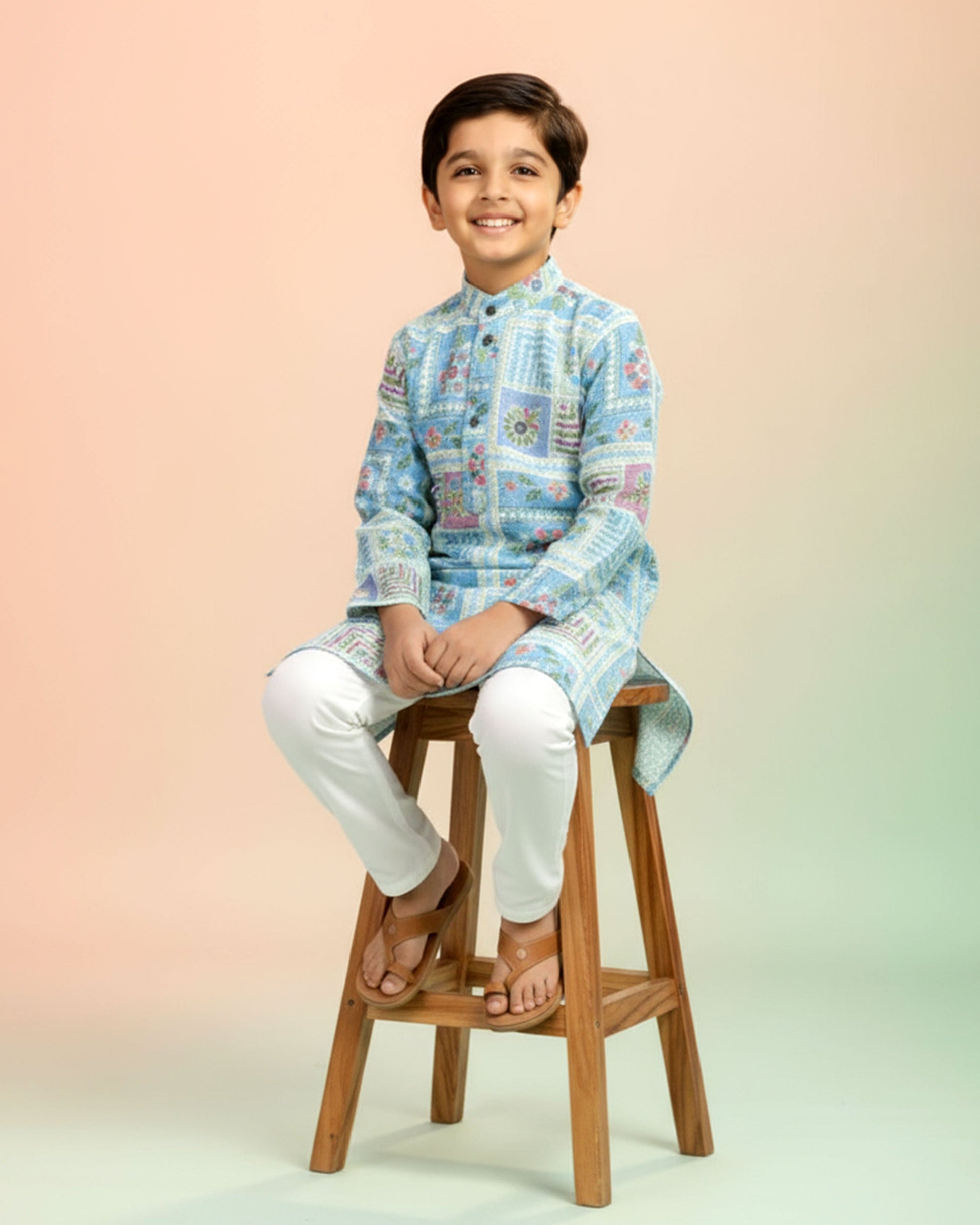 Boys green kurta adorned with traditional Bandhani-inspired patterns in red and gold., Light Green