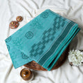 Bengal Cotton Saree With Geometric and Floral Motifs In Aqua Blue Folded Close Up Display View
