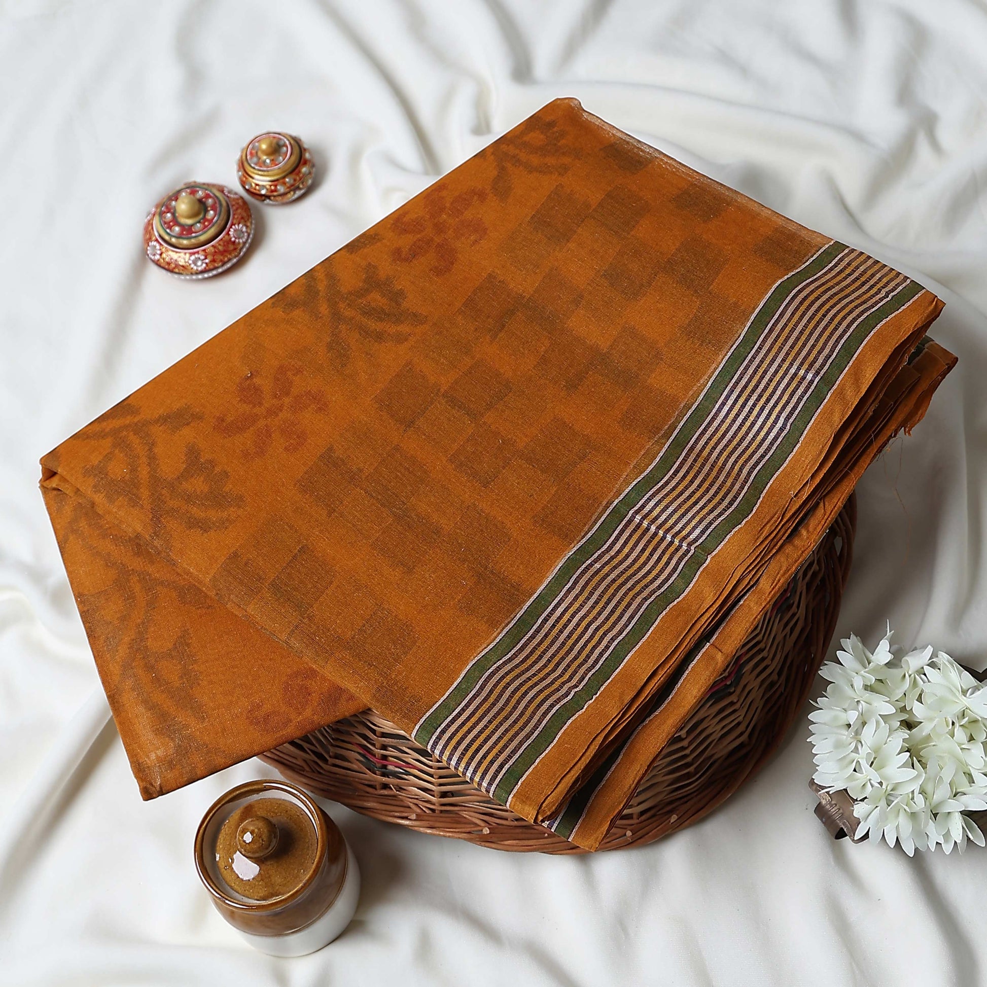 Bengal Cotton Saree With Floral Woven Motifs, Checked Pattern And Striped Border In Mustard Top Folded View
