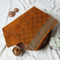 Bengal Cotton Saree With Floral Woven Motifs, Checked Pattern And Striped Border In Dark Orange Top Folded View
