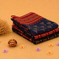 Semi Chanderi saree collection with blue, red and black traditional woven patterns folded stack front view.