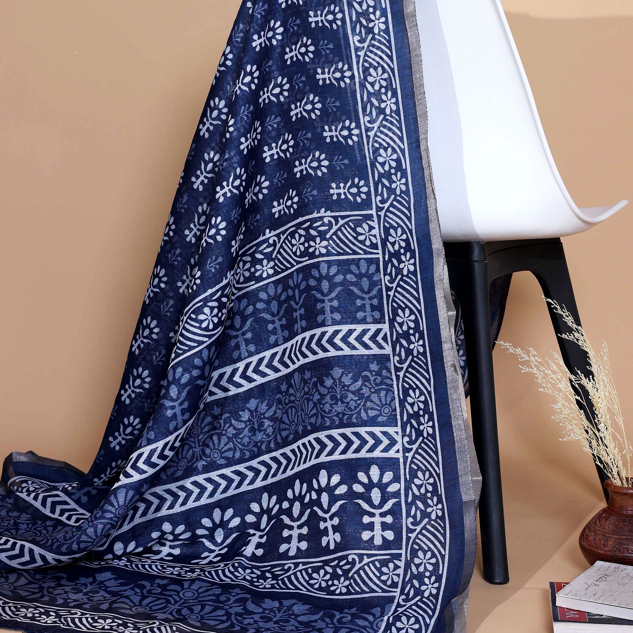 “Elegant Navy Blue Linen Saree with White Floral Motifs, Geometric Woven Border and Subtle Tassel Detailing