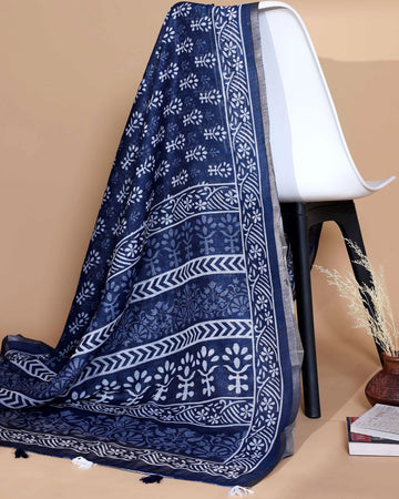 “Elegant Navy Blue Linen Saree with White Floral Motifs, Geometric Woven Border and Subtle Tassel Detailing