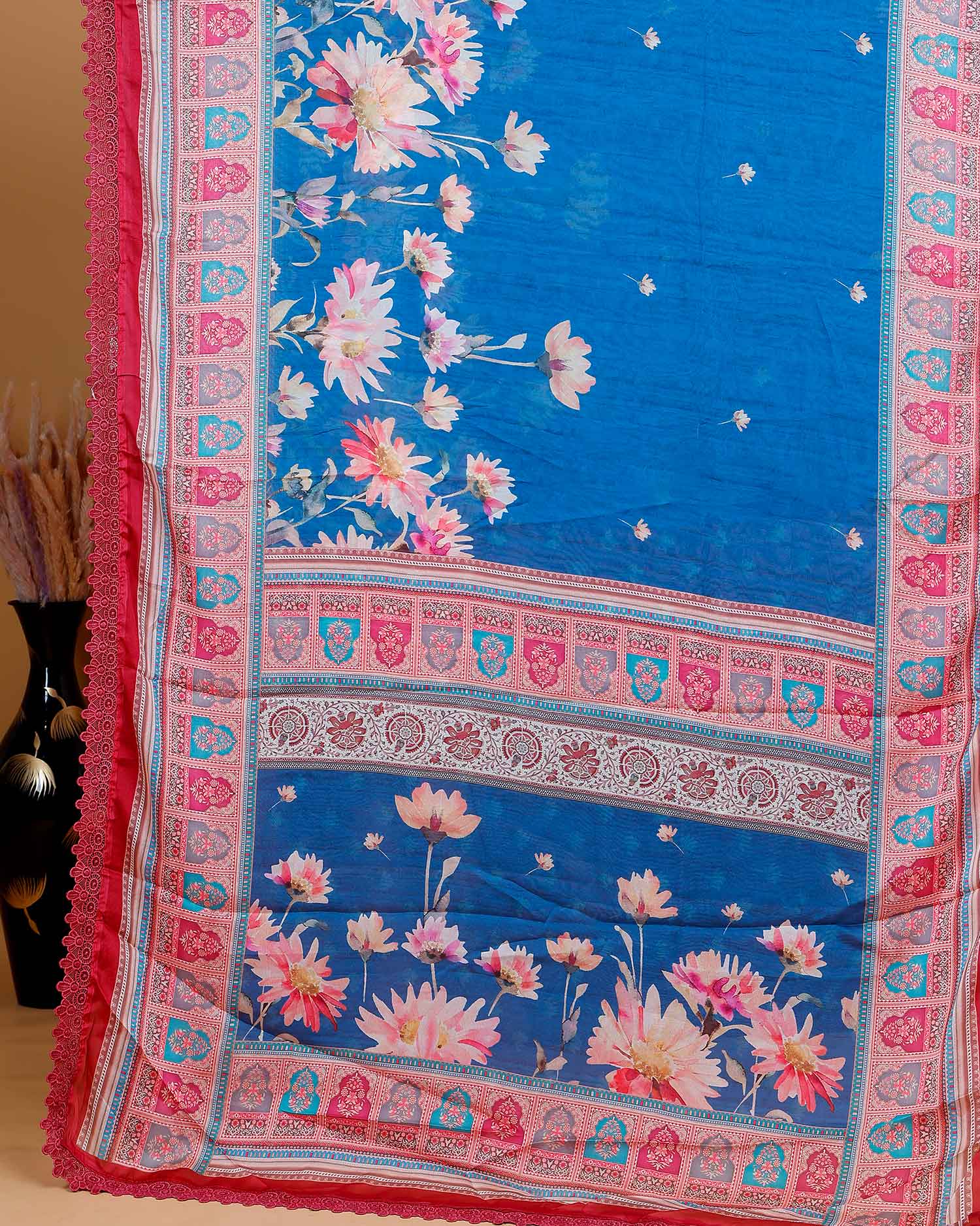 Stylish Georgette Saree with Bold Floral Prints and Traditional Patterned Border - Blue