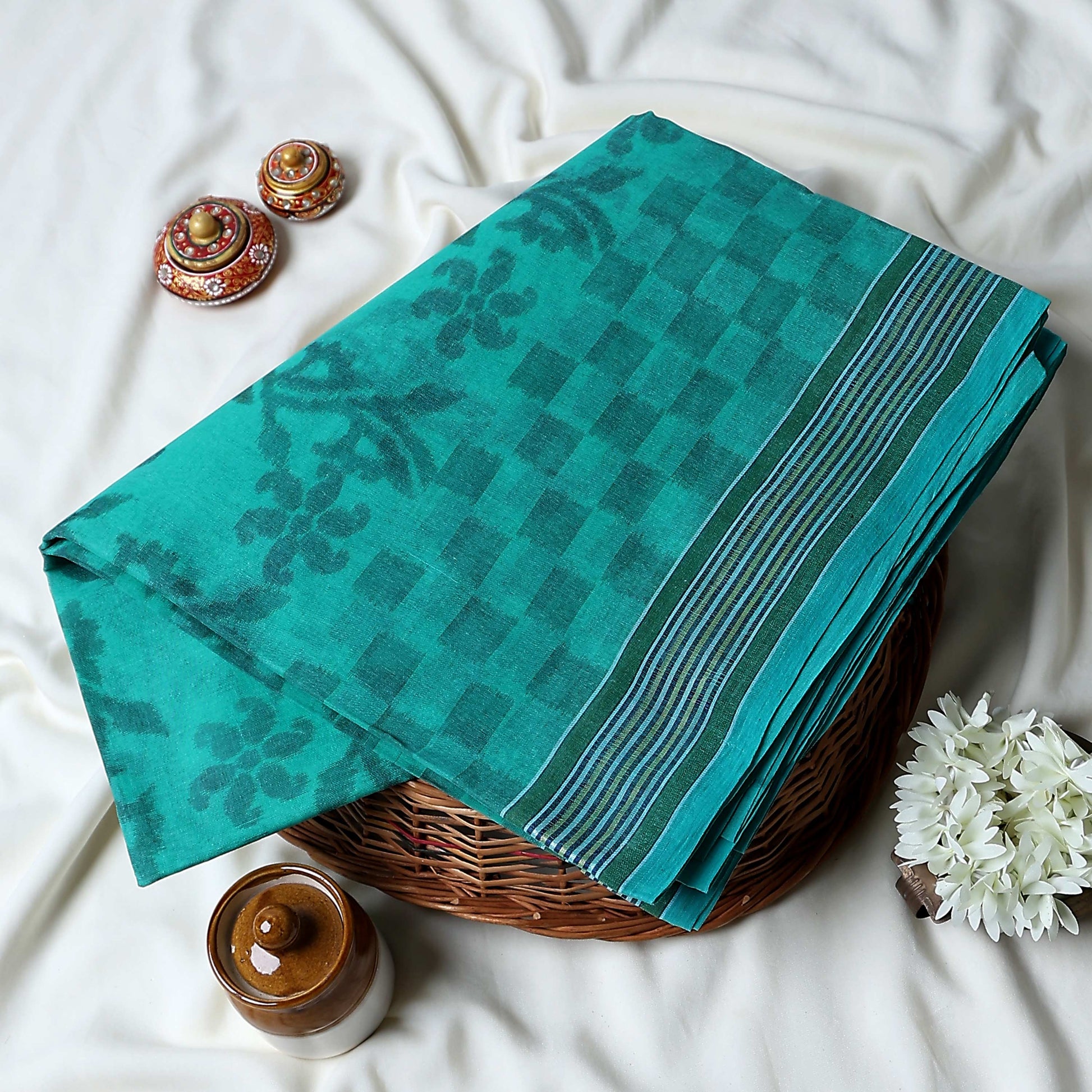 Bengal Cotton Saree With Floral Woven Motifs, Checked Pattern And Striped Border In Aqua Green Top Folded View