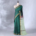 Dark Green Banana Pith Saree with Minimal Butta Motifs & Traditional Zari Woven Border -Full View