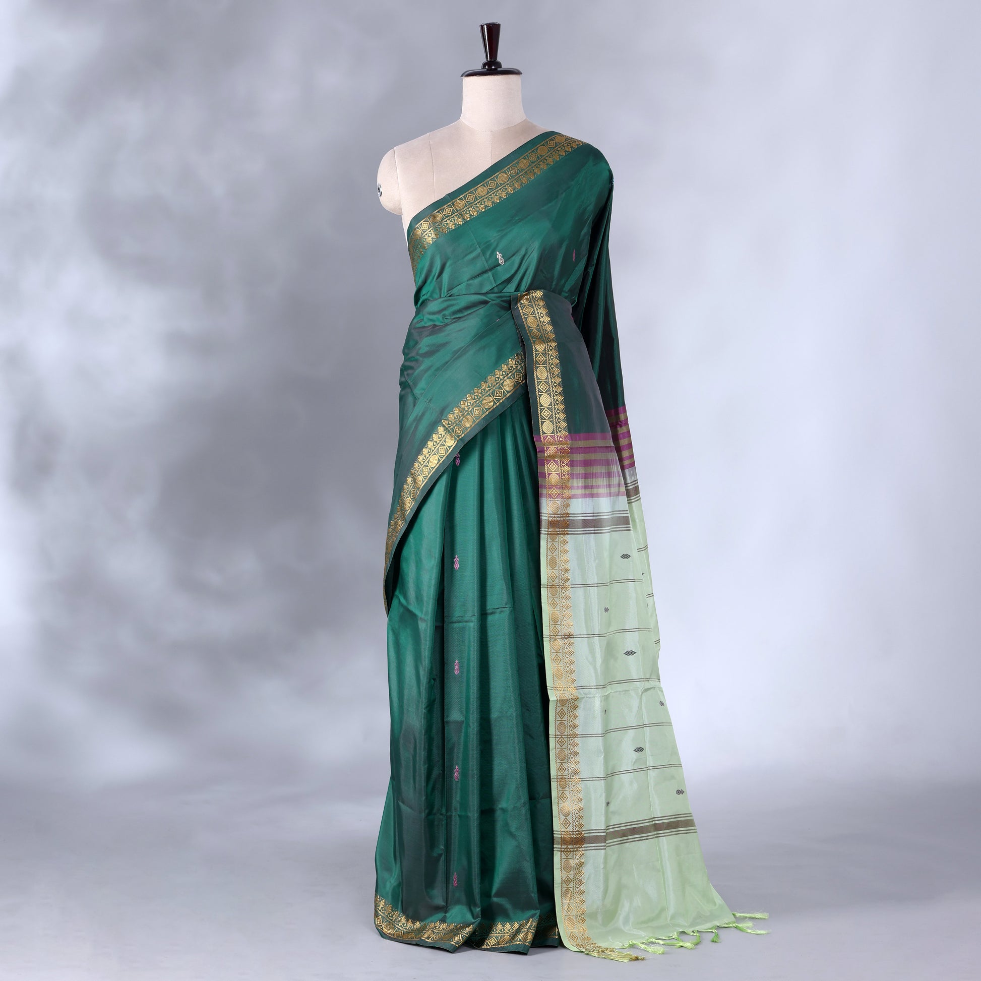 Dark Green Banana Pith Saree with Minimal Butta Motifs & Traditional Zari Woven Border -Full View