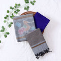 Top View Of Grey And Blue Salwar Suit Material With Striped Dupatta, Ikkat Woven Border, Tassel Details & Fabric Piece