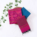 Top View Of Pink And Blue Salwar Suit Material With Striped Dupatta, Ikkat Woven Border, Tassel Details & Fabric Piece