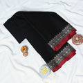Black Mangalagiri Cotton Saree With Intricate Geometric Zari Border And Red Edging Close Up Folded View
