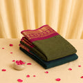 Kanchi Cotton Saree with Pink Zari Border in Olive Green, Folded Stack View Product Display