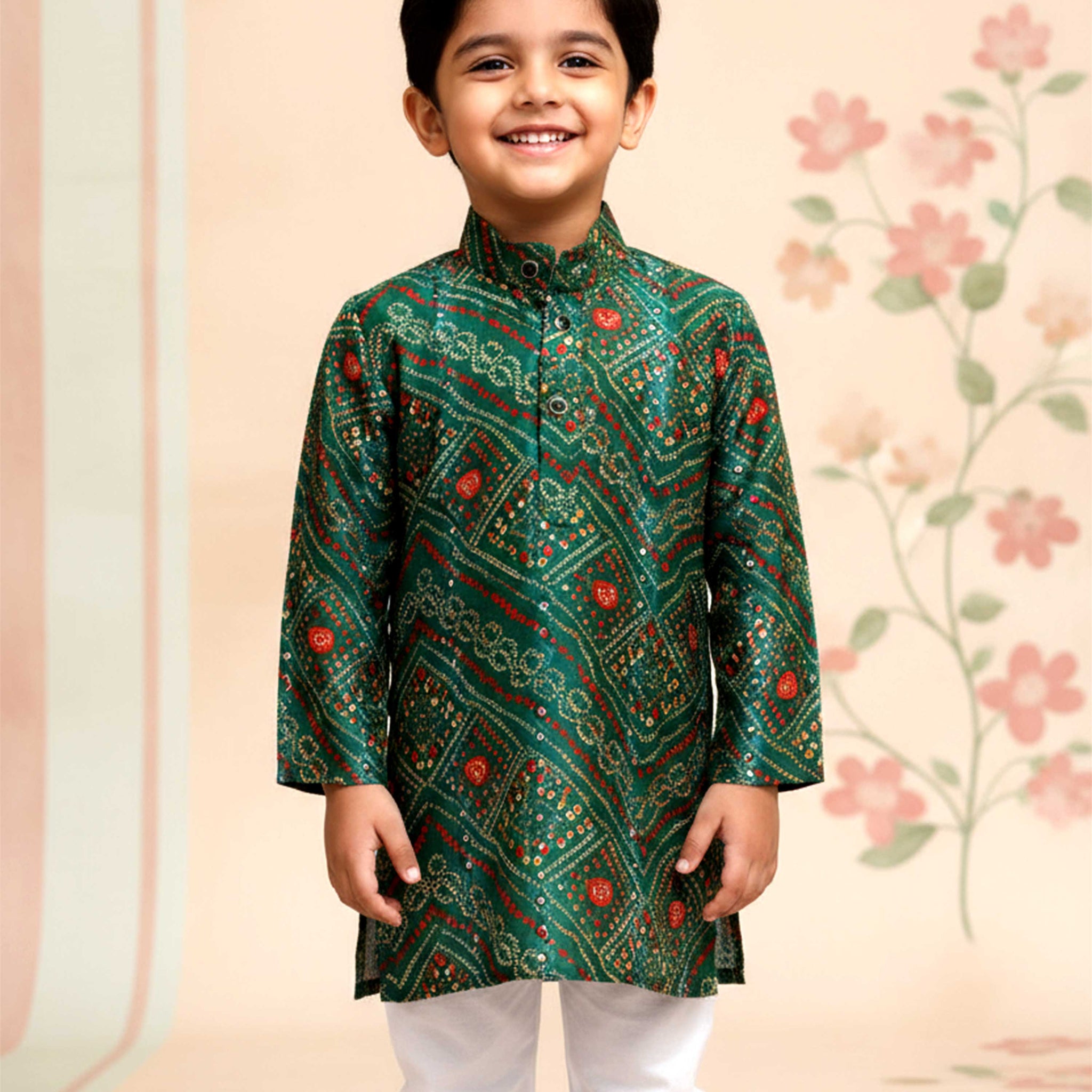 Boys green kurta adorned with traditional Bandhani-inspired patterns in red and gold.